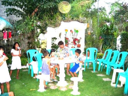 San Vicente home grotto with a few children who just prayed the 1st Saturday rosary.